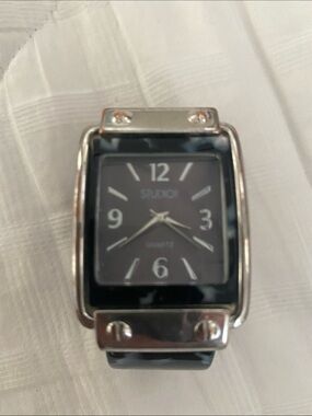 Studio Black and white women’s Rectangular cuff Watch. Needs battery.